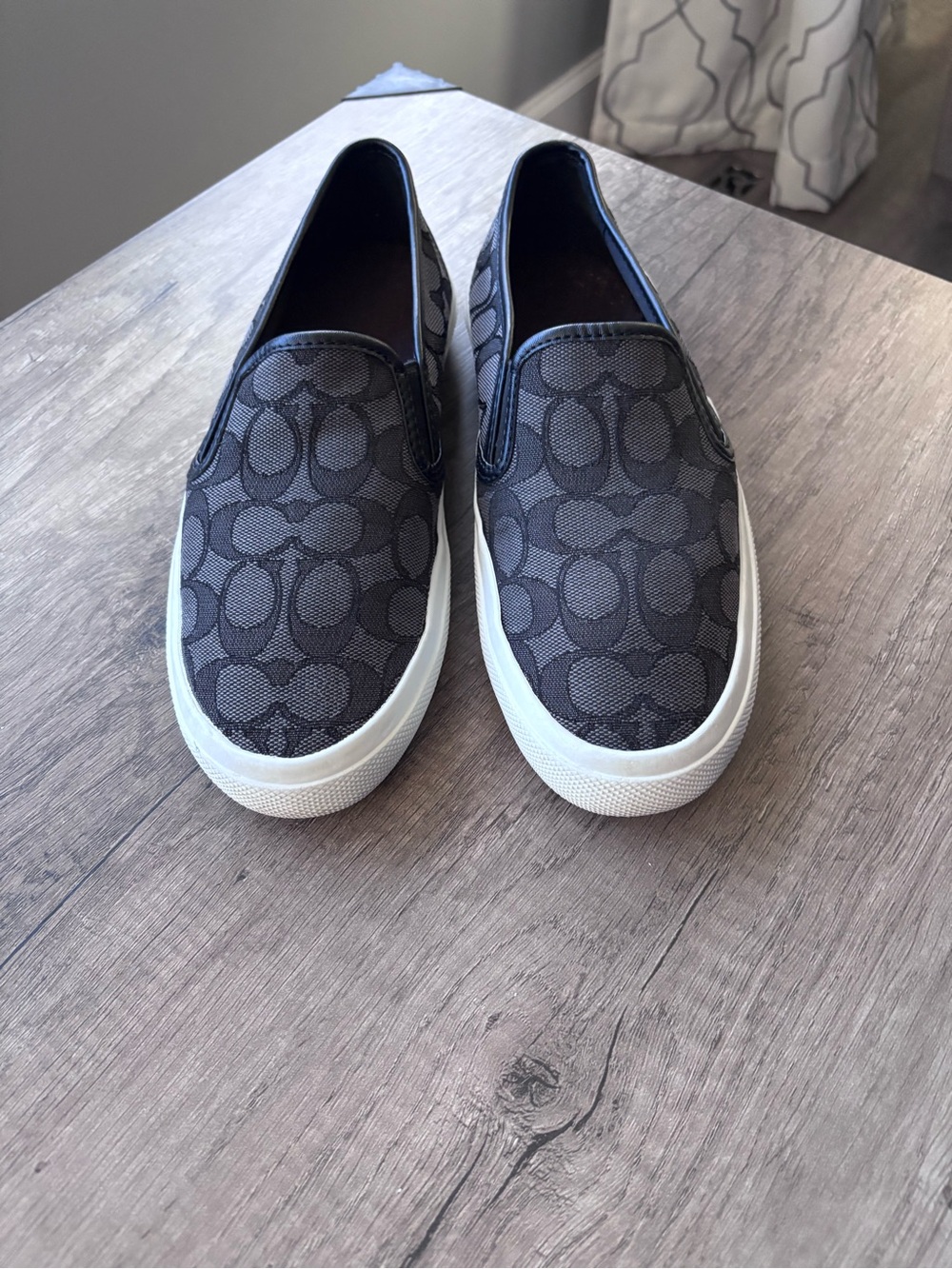 Coach Chrissy Women’s Black Signature Canvas Slip-On Sneakers with White Sole
